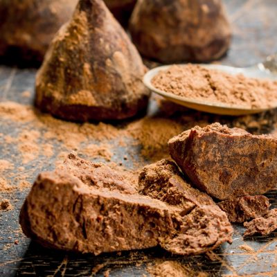 chocolate candy truffles with cocoa powder. on a wooden background.